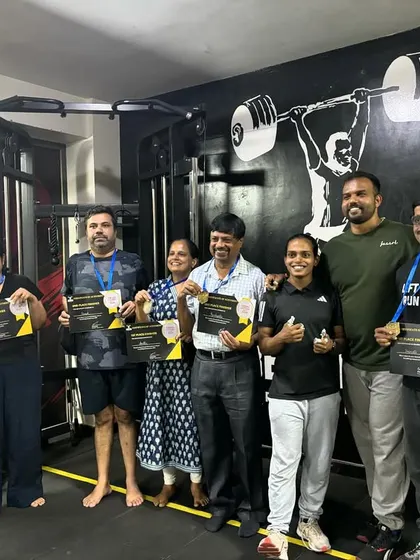 A group of our members, both men and women, celebrating their achievements.