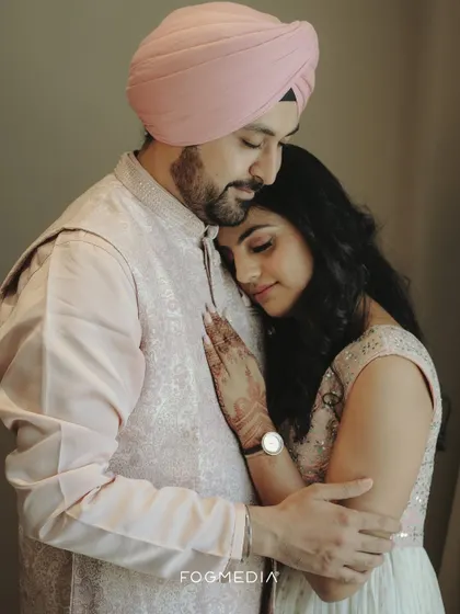 An intimate embrace, capturing the quiet comfort and love between the newly engaged couple.