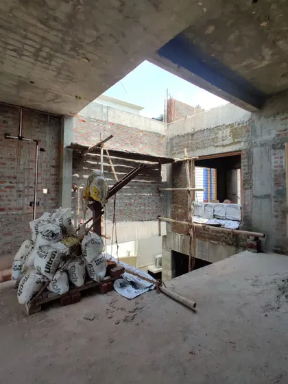 The interior of the house during construction, showing the multi-level spaces and skylights.