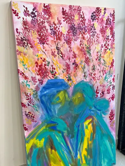 This vibrant abstract painting was a custom wedding gift for a couple in Delhi. It depicts the couple in an embrace, surrounded by an explosion of colorful flowers representing their dreams and desires.
