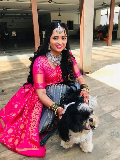 The bond between a bride and her pet is always so special to witness. She looks radiant and happy.