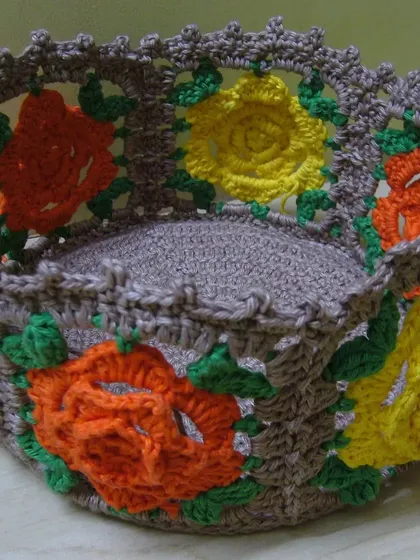 The finished rose granny square basket, seen from the inside. The openwork of the squares creates a beautiful, lacy effect.