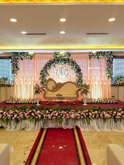 A wide shot of the stage, showing the full floral arrangement.