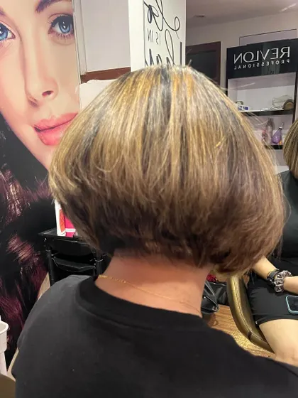 The back view of the fixed haircut, showing the clean, stacked layers.