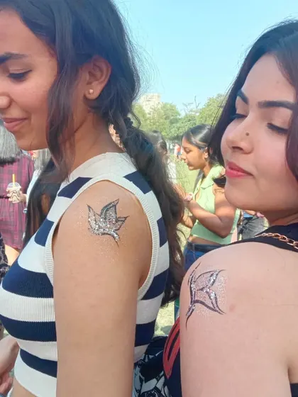 Matching temporary tattoos are a fun activity for friends. Here are two different glittery butterfly designs I painted on the shoulder and upper arm.
