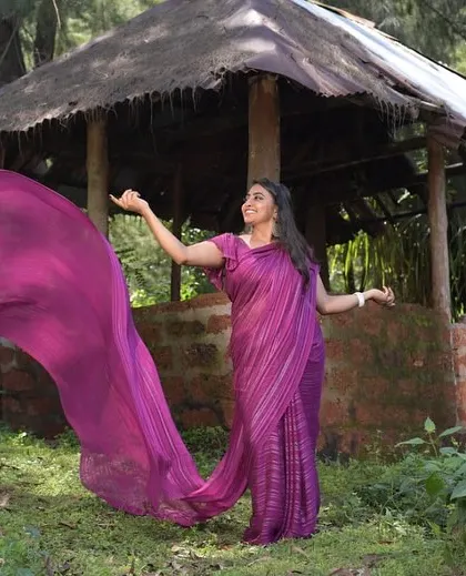 A beautiful shot of our purple long trail saree, perfect for creating a dramatic and elegant look.