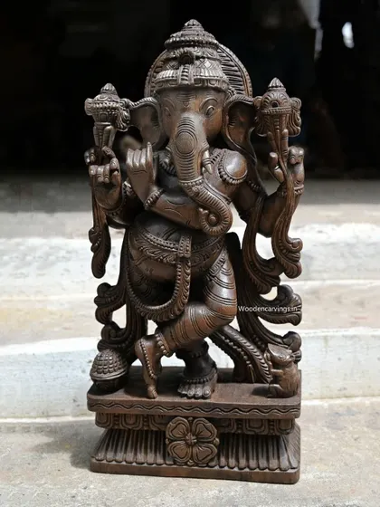 A recently sold 24-inch Flute Maha Ganapathy. This rare depiction of Ganesha playing the flute showcases our ability to create unique and artistic interpretations of traditional forms.