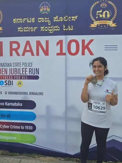 A happy runner from our team after completing the Golden Jubilee 10K.