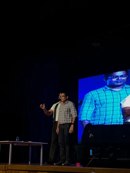 Interacting with an audience member during my TEDxSABVMCRI performance. Getting participants involved is crucial to demonstrating the principles of psychology and perception that I discuss in my talks.