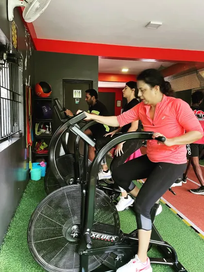 Clients use the air bikes for a high-intensity cardio blast.