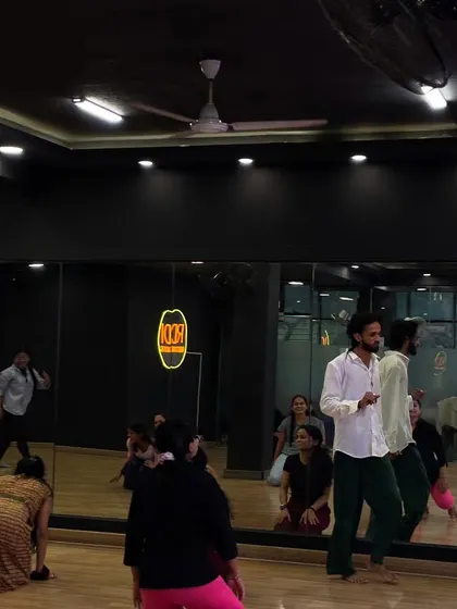 A candid shot from the Contemporary workshop, showing students practicing their floor work.