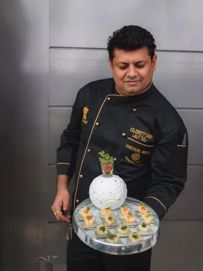 Celebrity Chef Lalit Tuli presenting a tray of his innovative creations. This is the culinary perfection we bring from our kitchen to your event.