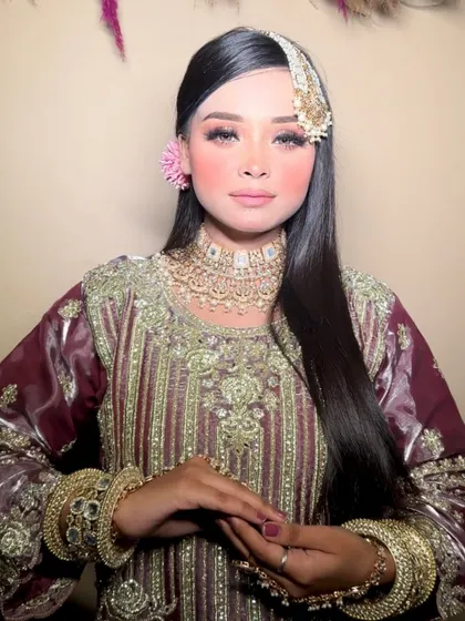 A beautiful Muslim bridal look with a focus on radiant skin and soft, romantic eyes. The heavy jewelry is perfectly balanced with the elegant makeup.