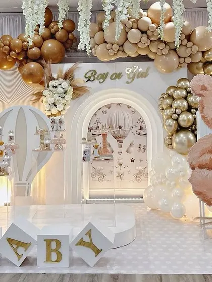 This grand teddy bear themed baby shower is one of my signature looks. The neutral palette with gold accents, extensive balloon arrangements, and custom 'BABY' blocks create a luxurious and welcoming atmosphere for a gender-neutral celebration.