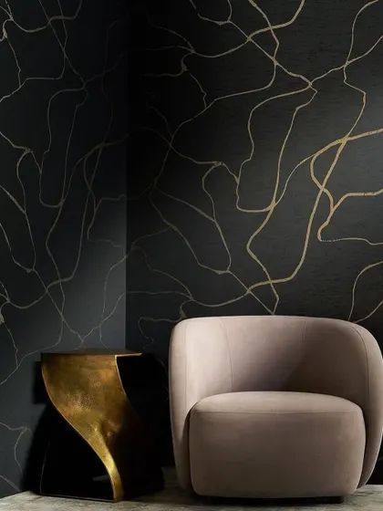 This silk-like textile from Phillip Jeffries shimmers with stunning luster. The free-flowing metallic lines on a dark background add pattern, movement, and a touch of organic elegance to the space.