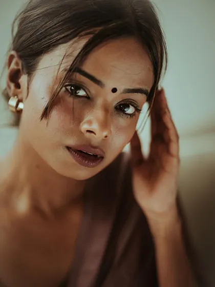 An intense and soulful close-up portrait. The direct gaze and minimal styling create a powerful connection, showing the emotional range I aim to capture.