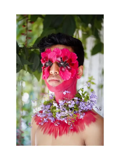 A close-up of the floral makeup concept, focusing on the intricate details and the raw emotion in the subject's eyes.