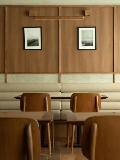 Further images from the BeWell, QBF Coffee, and Tubu projects, illustrating the consistent use of natural materials, clean lines, and thoughtful lighting to create serene and restorative commercial spaces.