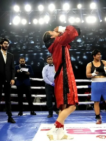 A magical moment. A female fighter celebrates winning her WBC title.