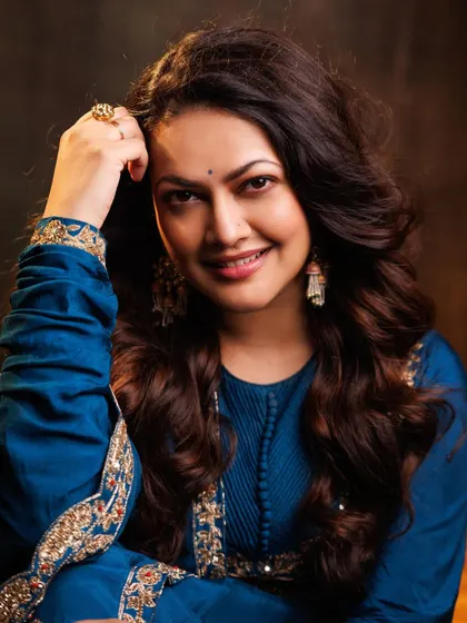 A lovely close-up portrait of Priyanka Barve, highlighting the beautiful earrings and the rich color of the Anarkali.