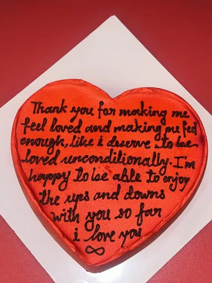 A "letter cake" where your personal, heartfelt message is written directly onto a heart-shaped cake. It's a deeply personal and romantic gesture.