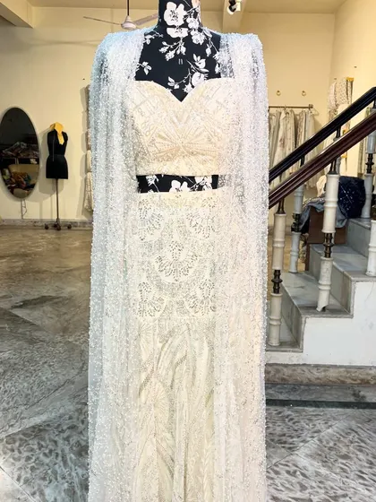 The full view of the 'APSARA' lehenga with the cape. It’s a stunning ensemble for a modern bride.