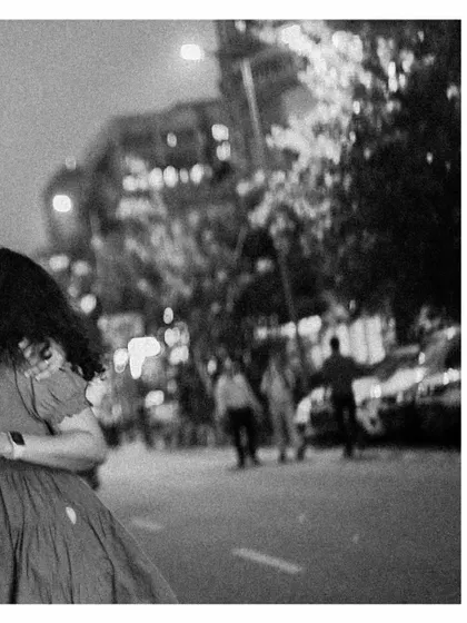 An artistic, blurry black and white shot that focuses on movement and the feeling of being in a bustling city.