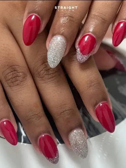 A final look at the beautiful red and silver glitter manicure, perfect for any celebration.