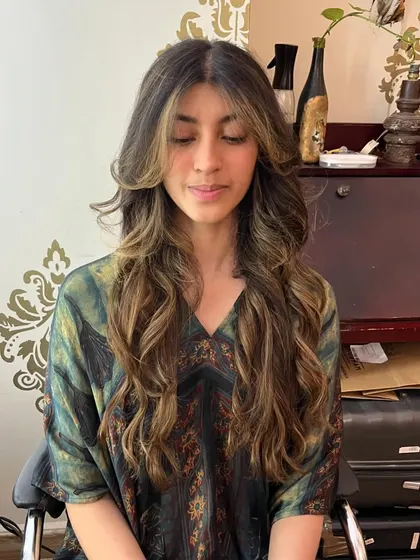 The after: curtain bangs and invisible layers give Trisha's hair a whole new life.
