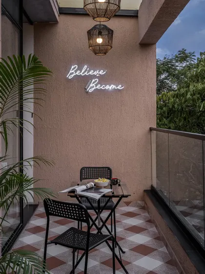 This is one of my favorite spots in our office. The balcony serves as a small escape, with Chettinad-inspired floor tiles and a simple neon sign that acts as a daily reminder to believe and become. It’s a perfect spot for a quick chai break.