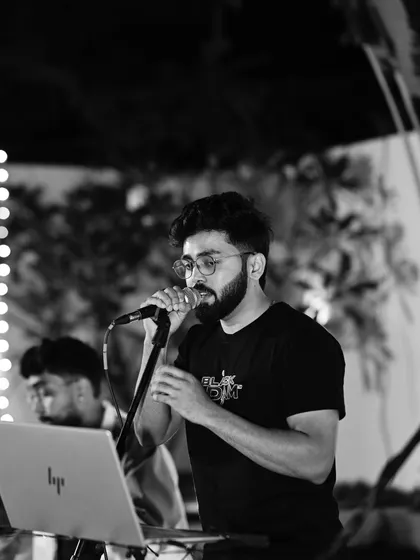 A close-up shot from a live gig, lost in the music. I focus on delivering a performance filled with genuine feeling, connecting with the audience through every song.