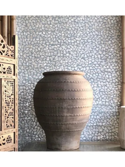 This unique wallcovering is made from natural Capiz shell flakes, hand-woven to form a mosaic. I use such materials to bring an element of the natural world indoors, creating a surface that shimmers and catches the light beautifully.