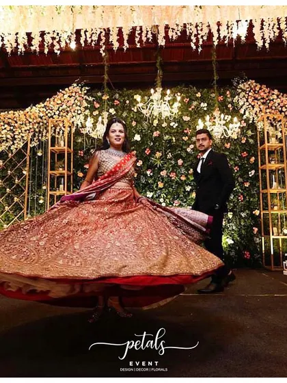 A duplicate image of the couple on their glamorous reception stage, capturing a moment of pure joy and celebration.