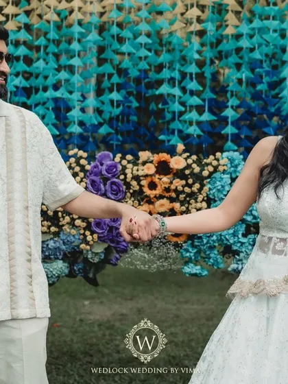 We designed this Haldi and Mehendi with multiple unique color palettes. The decor featured everything from stunning yellow and blue floral arrangements to lively orange accents for a truly dynamic celebration.