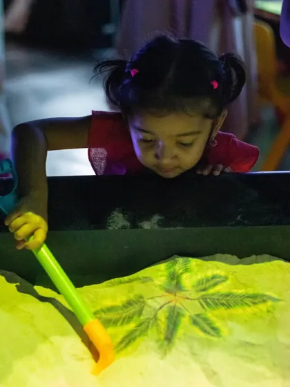 Creating virtual volcanoes and rivers in our illusion sand pit, where augmented reality brings the sand to life.