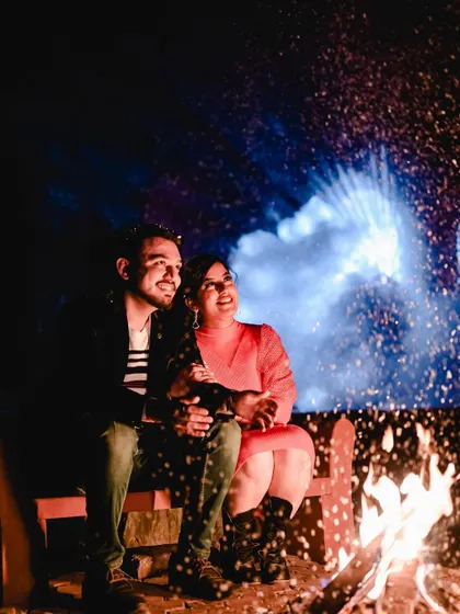 A cozy and romantic moment by the bonfire. We can create a real bonfire for your shoot, complete with magical spark effects for an enchanting photo.