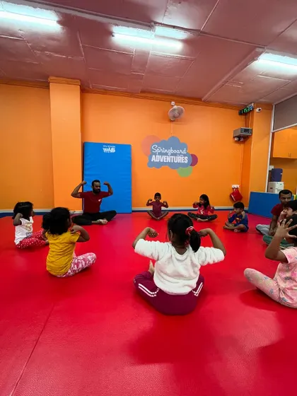 Showing off our strong muscles. This group exercise is a fun way to end a class, celebrating the strength and hard work of all our little champions.