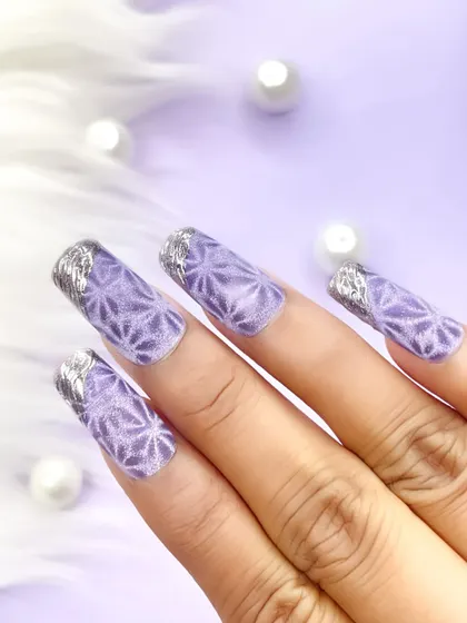Another view of the lavender geometric cat-eye nails, showing the clean, sharp lines and the shimmering effect of the polish.