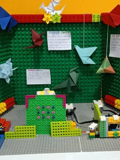 This LEGO project by our 'Orkiata Explorers' team combines engineering with art, featuring a LEGO structure decorated with origami. It showcases how we encourage interdisciplinary creativity.