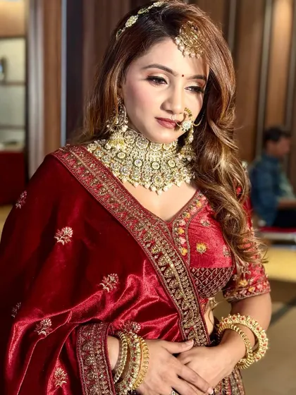 A pensive moment, showcasing the beautiful details of her reception makeup. The contour is soft, and the highlighter gives her a stunning glow.