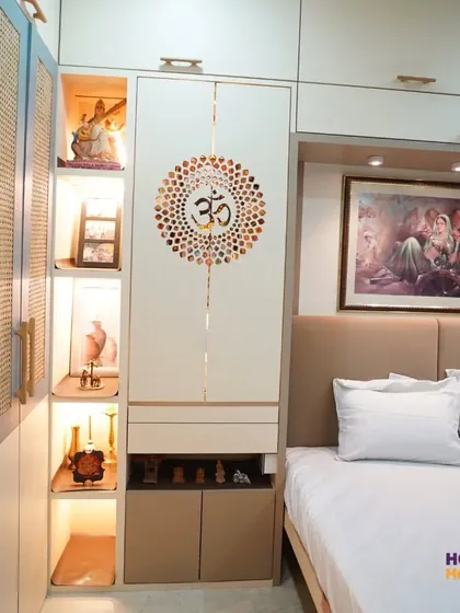This design shows how a mandir can be elegantly incorporated into a bedroom wardrobe. I used a beautiful "Om" mandala on the cabinet door, which opens to a dedicated, warmly lit niche for prayer. This solution provides a personal spiritual corner without requiring a separate room.