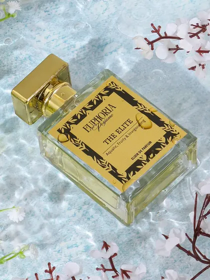 This aquatic perfume is styled in clear water with floating white blossoms. The ripples and fresh setting visually represent the 'Aquatic, Fruity & Invigorating' notes of the fragrance.
