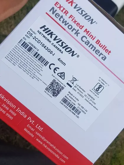 The box label for a Hikvision 4MP EXIR fixed mini bullet network camera, showing the model and specifications.