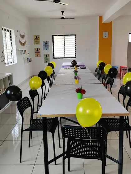 The studio is a blank canvas for your party! Here it is set up with black and yellow balloons for a fun celebration.