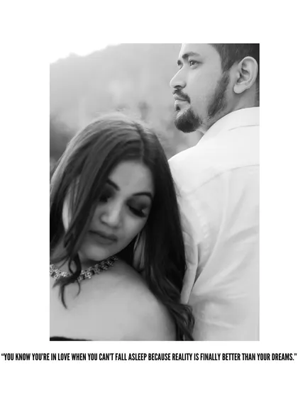 A classic black and white portrait from a pre-wedding shoot. The soft focus and composition create a dreamy, romantic feel.