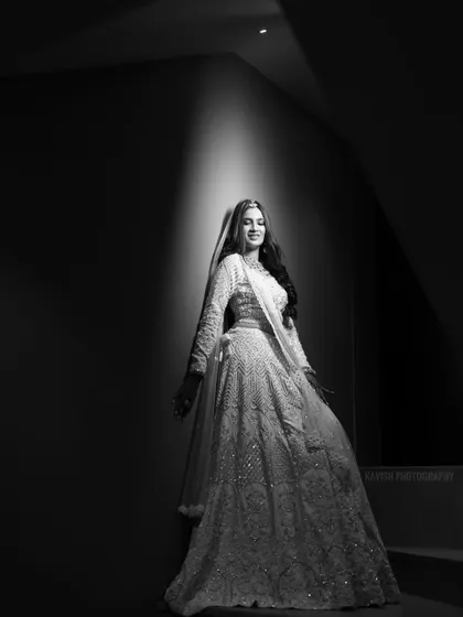 Another powerful black and white shot on the stairs, focusing on the bride's form and the play of light and shadow.