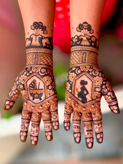 A cute and modern take on baby shower mehendi, with "BOY" and "GIRL" spelled out on the fingers and illustrations of a pregnant silhouette and a baby carriage.