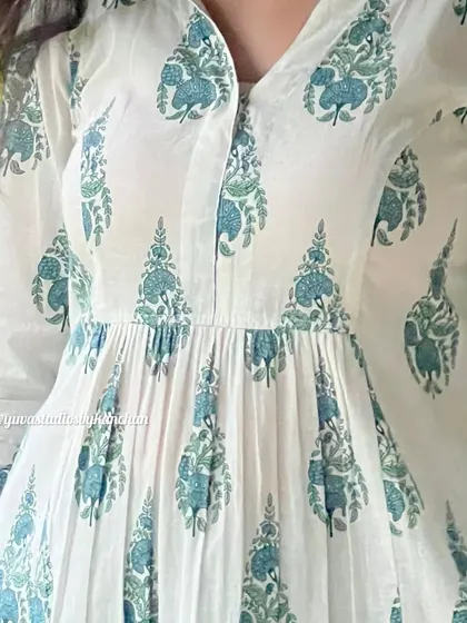 A close-up on the delicate print and gathered waist of our white and green kurta, showcasing the details that make it special.