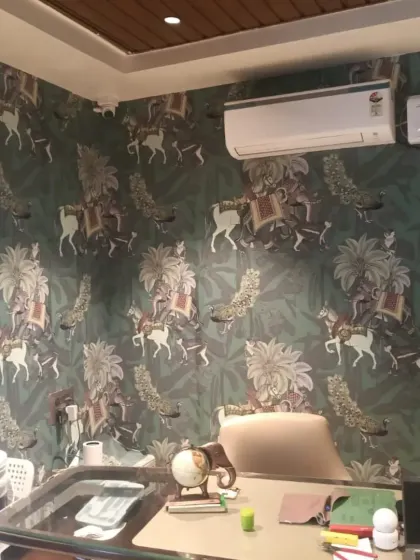Another view of the royal procession wallpaper, installed in an office or study.
