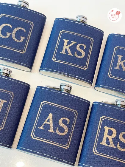 Personalized leather-wrapped flasks with custom initials are a classic and stylish gift for any groomsman.